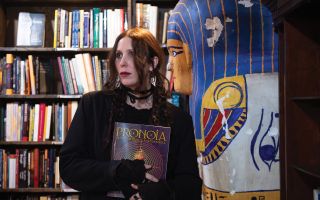 Chelsea Wolfe holds a book
