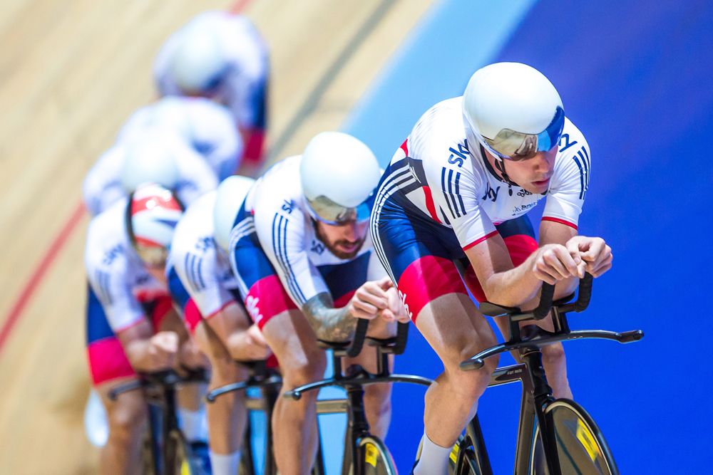 Bradley Wiggins sits second wheel