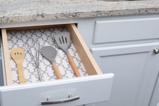 a kitchen drawer with a patterned liner