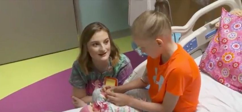 Montana Brown with a young patient.