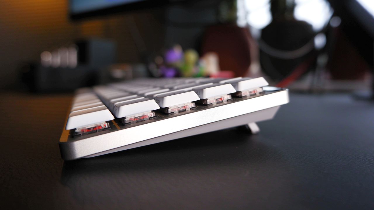 The ROG Falchion RX gaming keyboard in white set up on a desk.