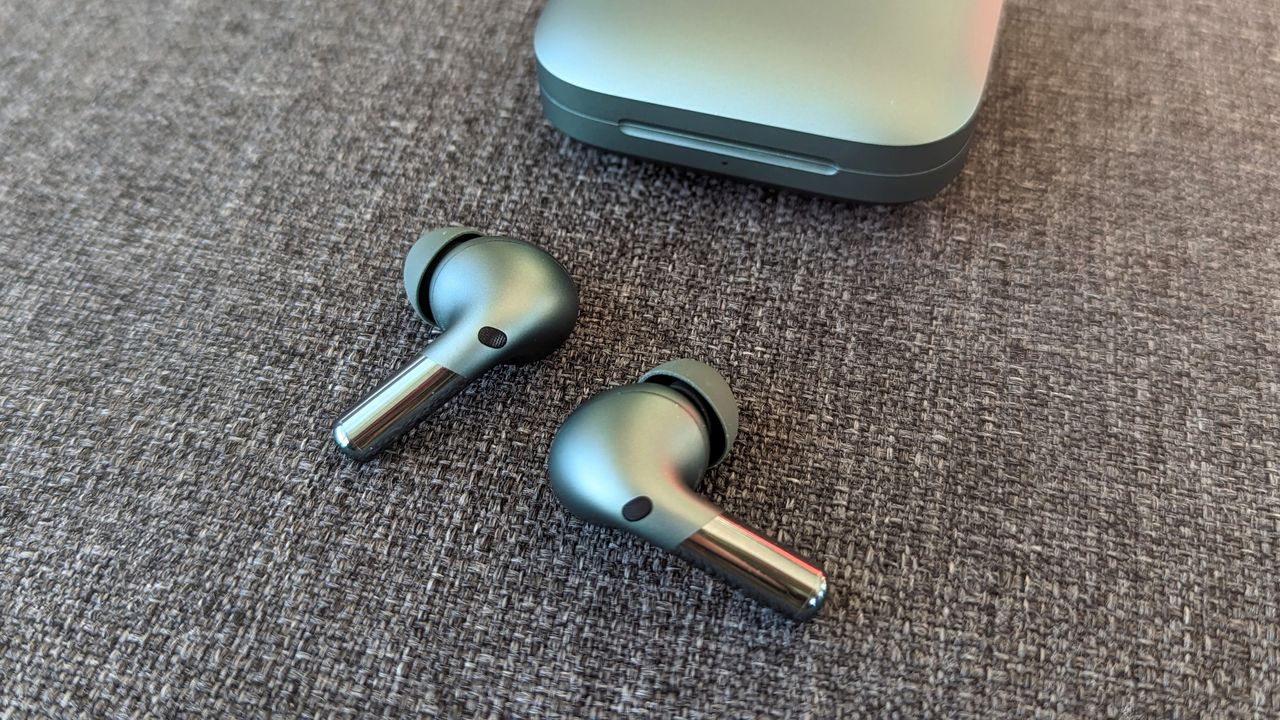 OnePlus Buds Pro 2 review: earbuds outside of charging case in blue