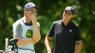 Ludvig Aberg of Sweden shares a laugh with his caddie Jack Clarke on the 17th tee during the final round of the John Deere Classic at TPC Deere Run