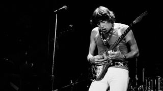 John Mayall playing guitar onstage at Greenwich Village's Bottom Line nightclub, New York on January 23, 1979