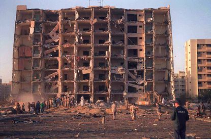 Investigators sift through the wreckage of the 1996 Khobar Towers complex