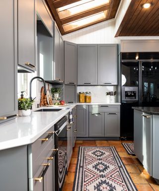 Kortney Wilson's modern kitchen with blue cabinets and quartz countertops