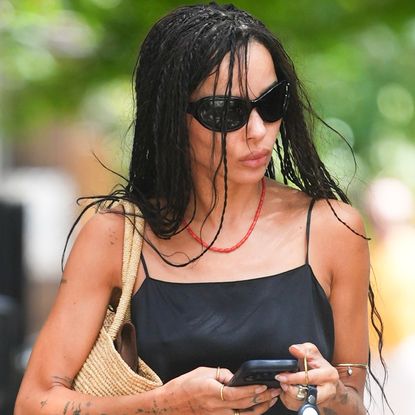 Zoë Kravitz tested the wrong shoe theory in denim shorts, a black camisole, and the mules trend for Fall 2026
