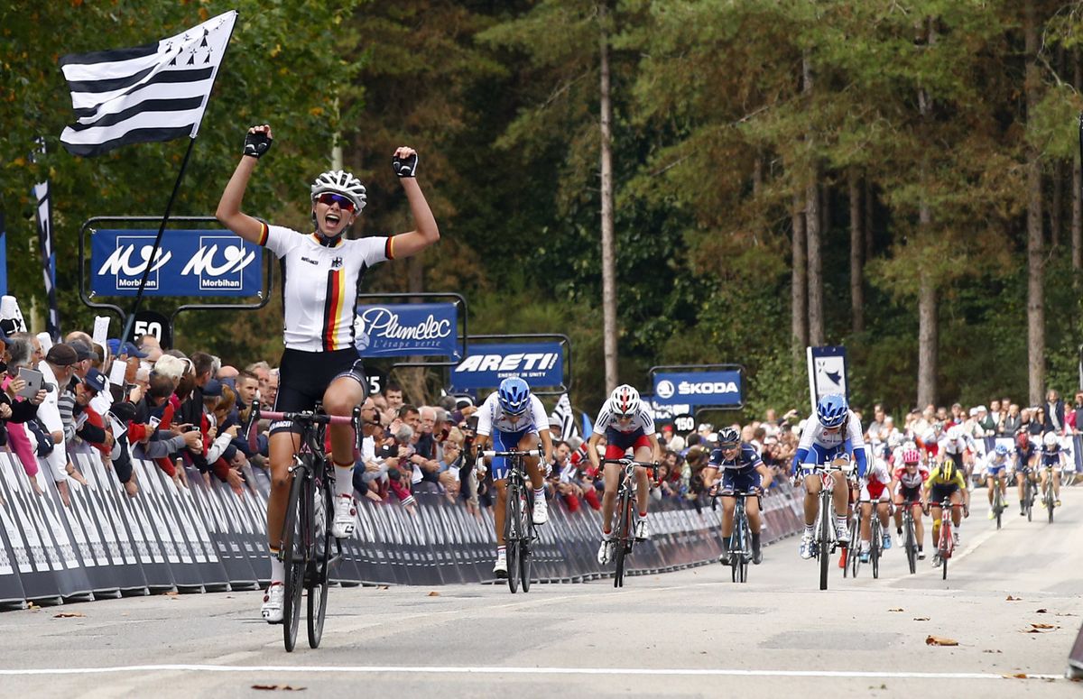 Liane Lippert celebrates as she crosses the line for gold