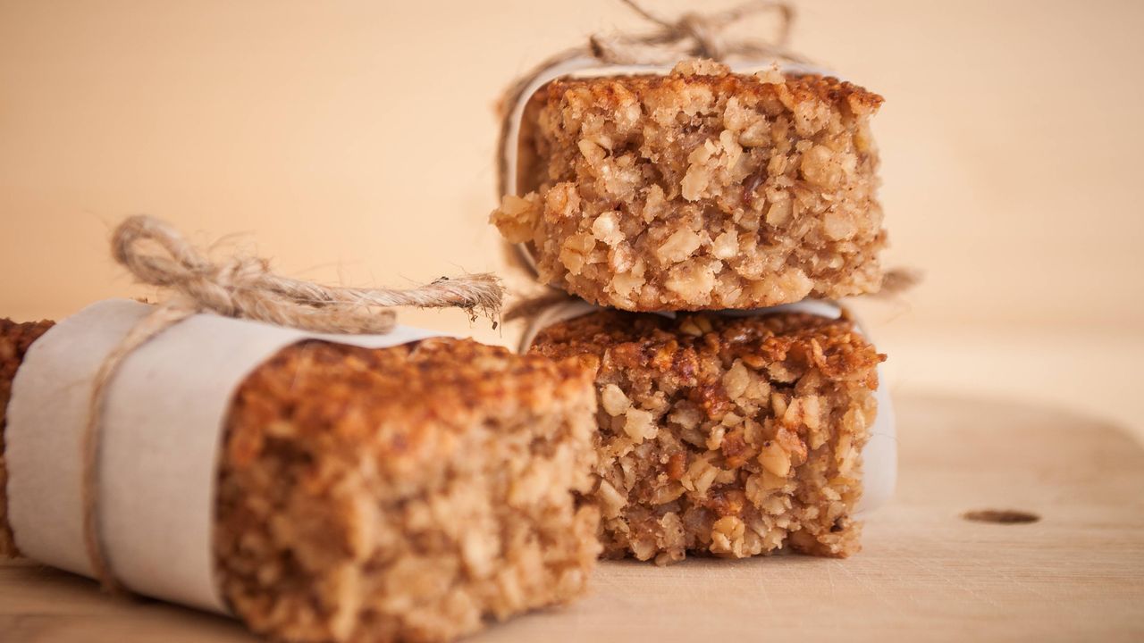 banana flapjacks wrapped in paper and string on a board