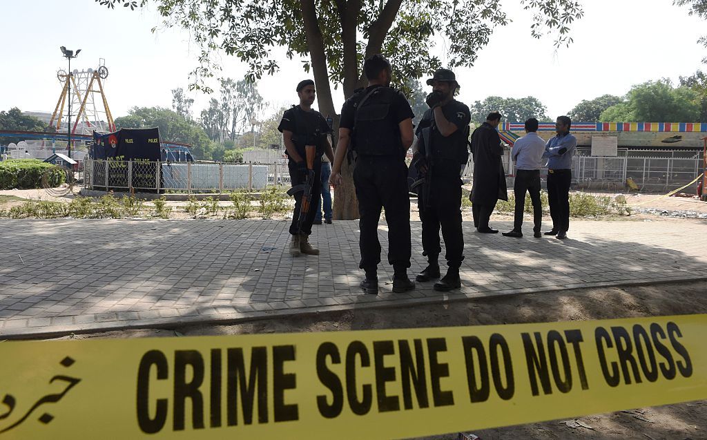 Pakistani police commandos stand guard at the suicide blast site in Lahore on March 28, 2016