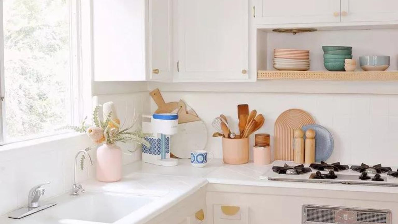 White kitchen with utensils on counter