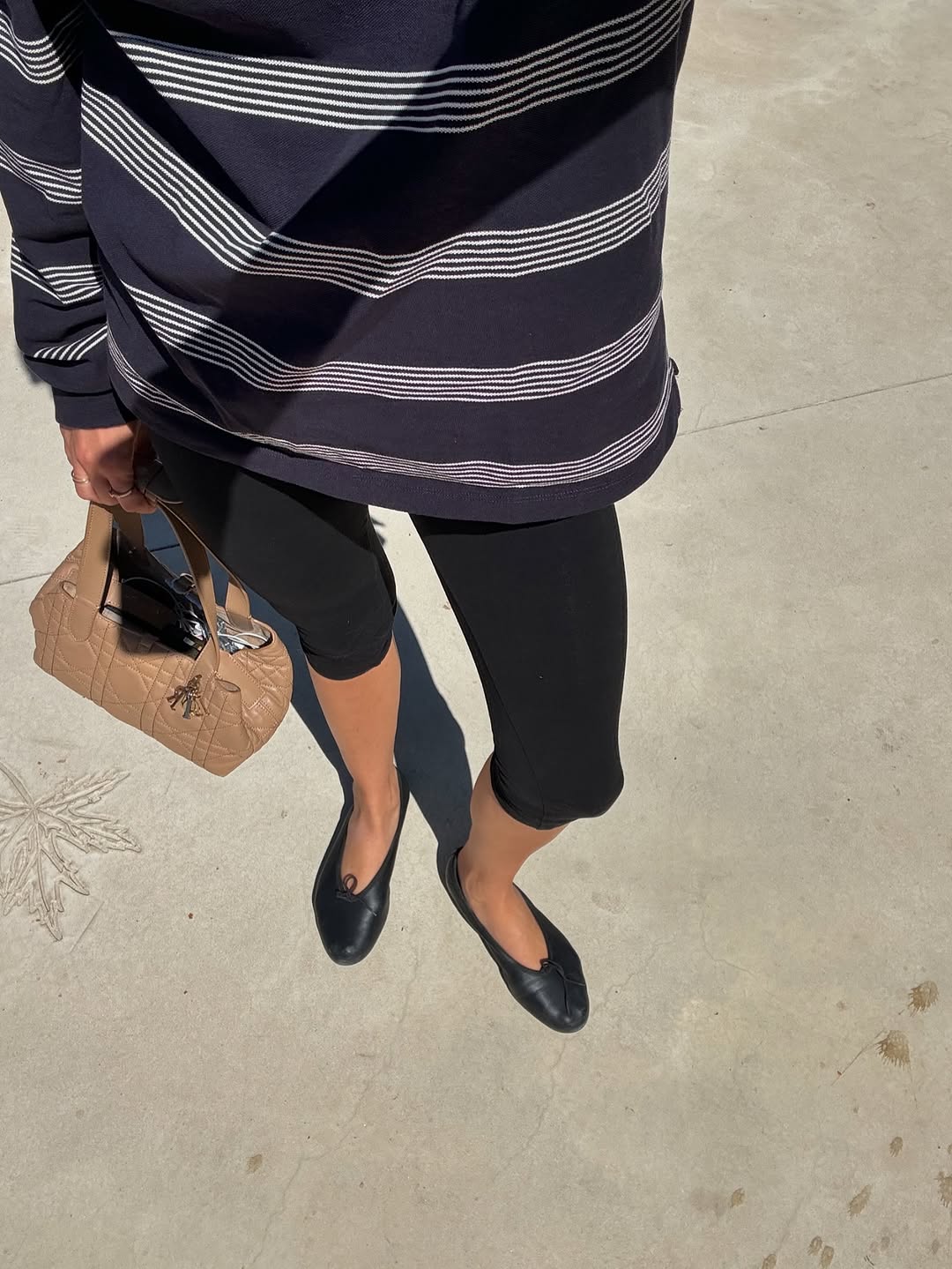 woman wearing black capri pants outfits 2025
