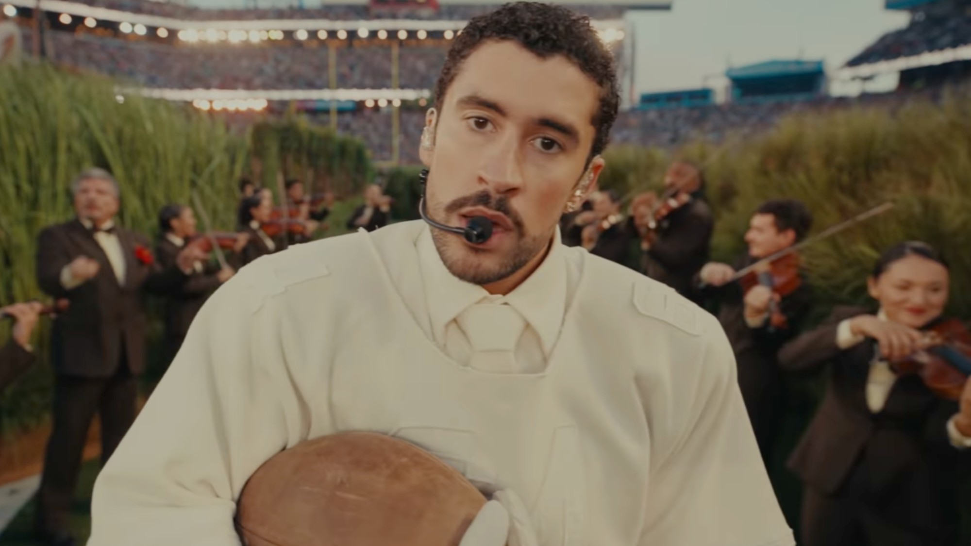 Bad Bunny performing to the camera during his Super Bowl Halftime Show. 