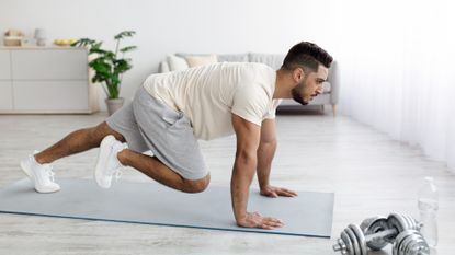 Man performing mountain climber ab workouts