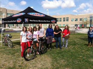 Students check out the Utah High School Cycling League information tent at East High School earlier this year.