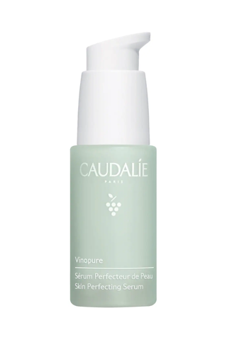 A bottle of Caudalie Vinopure skin perfecting serum set against a white background.