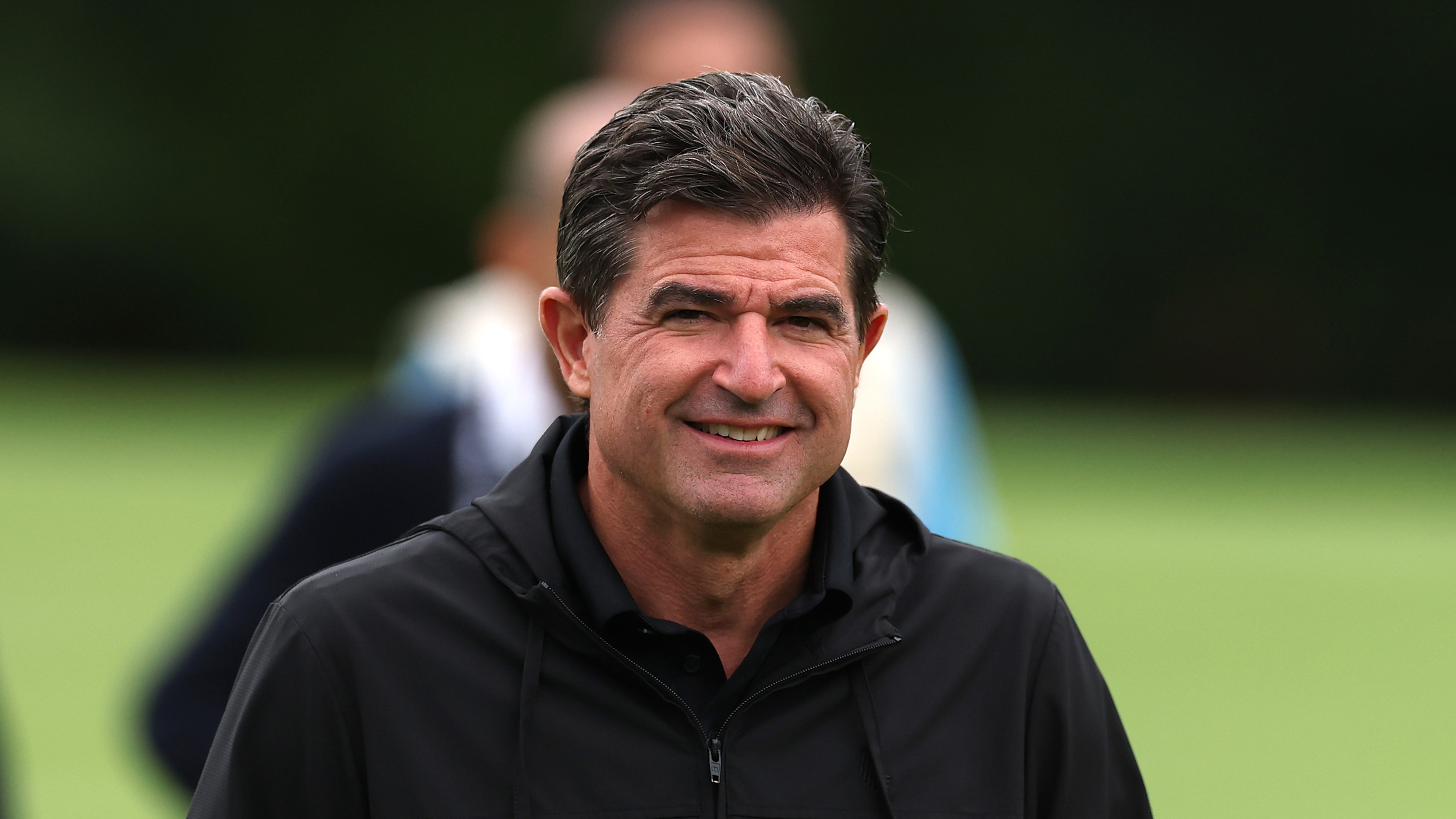 Scott O&#039;Neil smiles towards the camera during the 2025 LIV Golf UK event