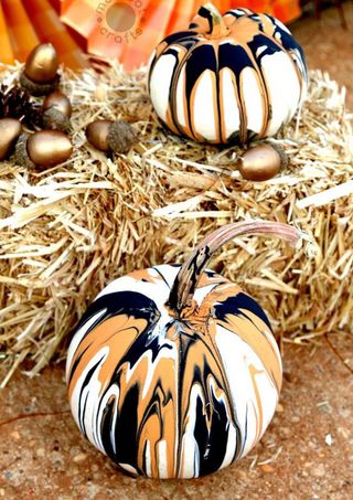 painted pumpkins with grass