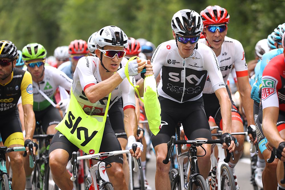 Team Sky's Michal Kwiatkowski and Chris Froome get a feed