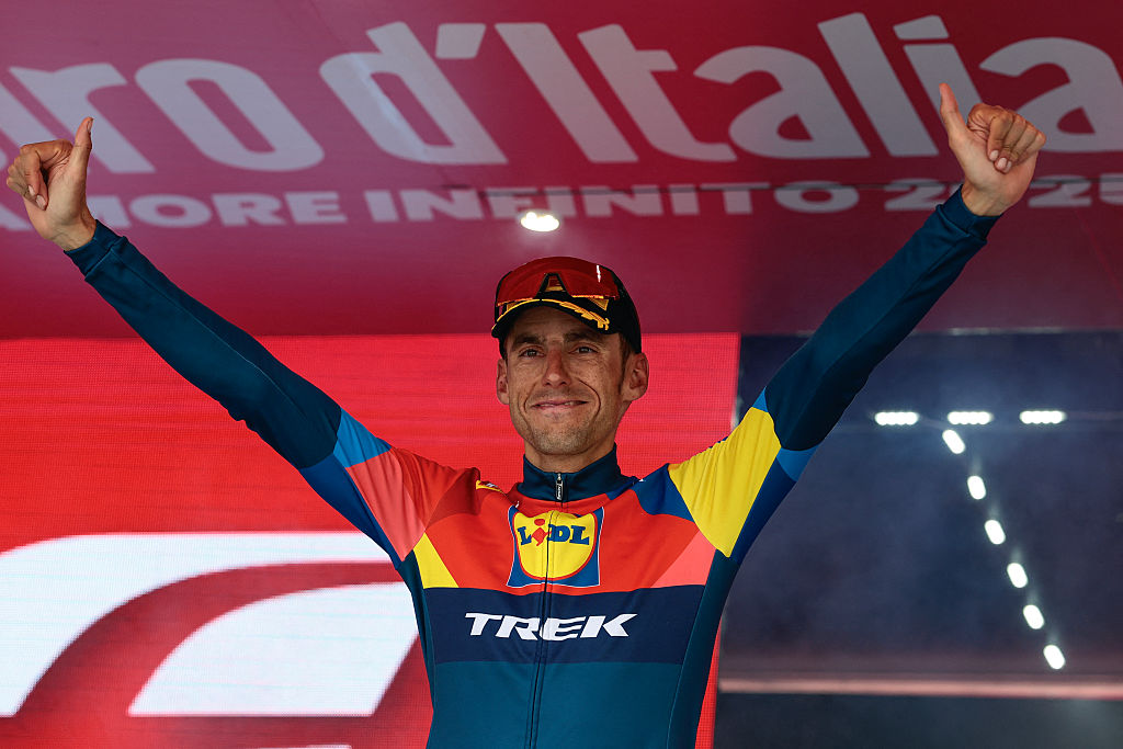 Lidl-Trek's Spanish rider Carlos Verona celebrates on the podium after victory in the 15th stage of the 108th Giro d'Italia cycling race of 219kms from Fiume Veneto to Asiago on May 25, 2025. (Photo by Luca Bettini / AFP)