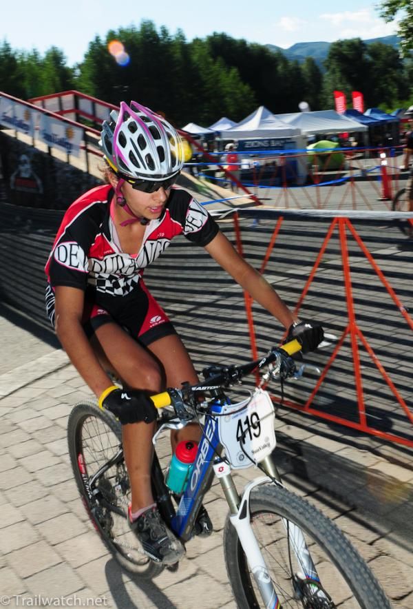 Kaylee Blevins (Durango) crosses the bridge over the river