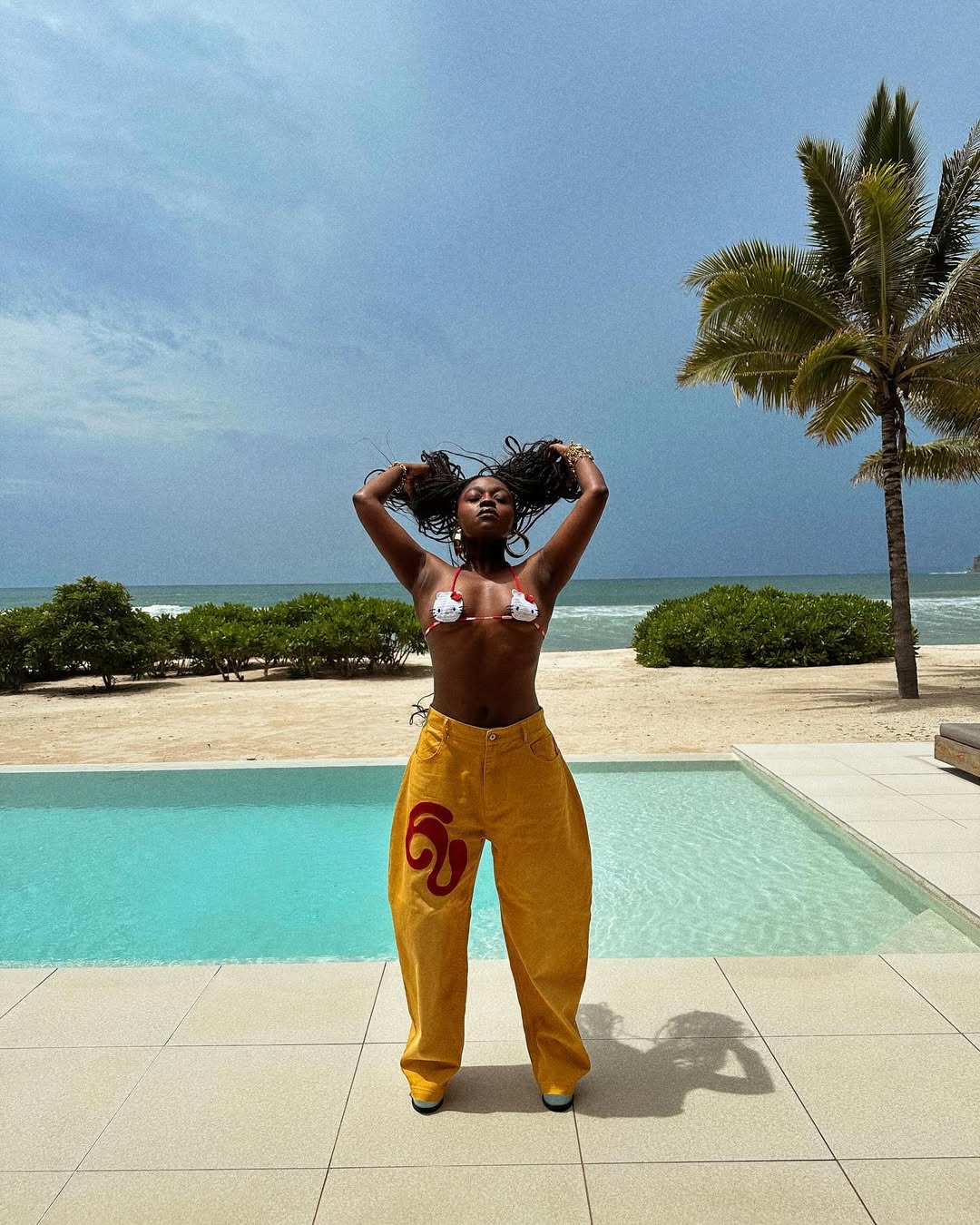 @fisayolonge wears yellow jeans bikini top