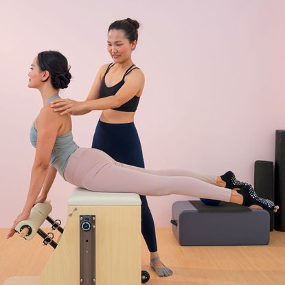 A woman doing one of the best free Pilates workouts