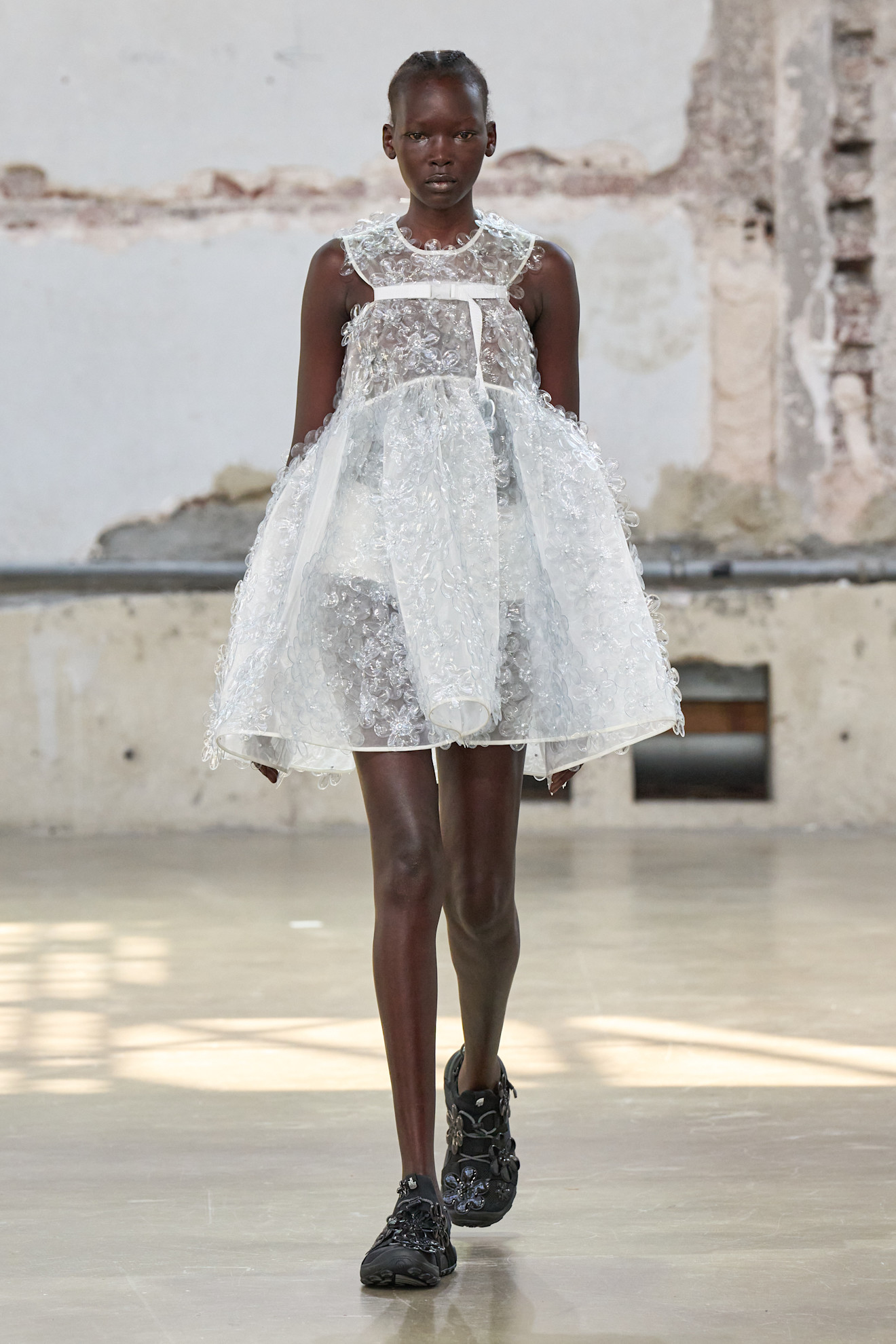 A model wore a babydoll dress on Cecilie Bahnsen's Spring 2026 runway