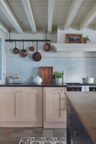 Pale pink kitchen with marble splashback