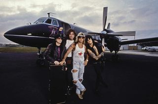 Motley Crue gathered at the side of a private jet