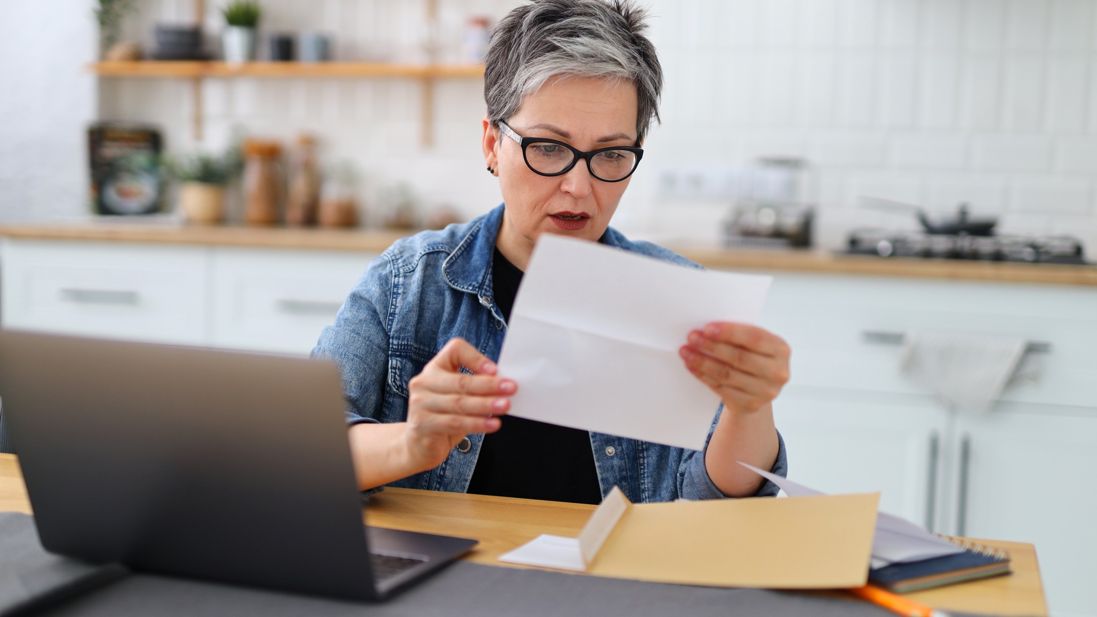 a surprised woman reading a report
