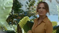 JLo on an island in the Office Romance trailer