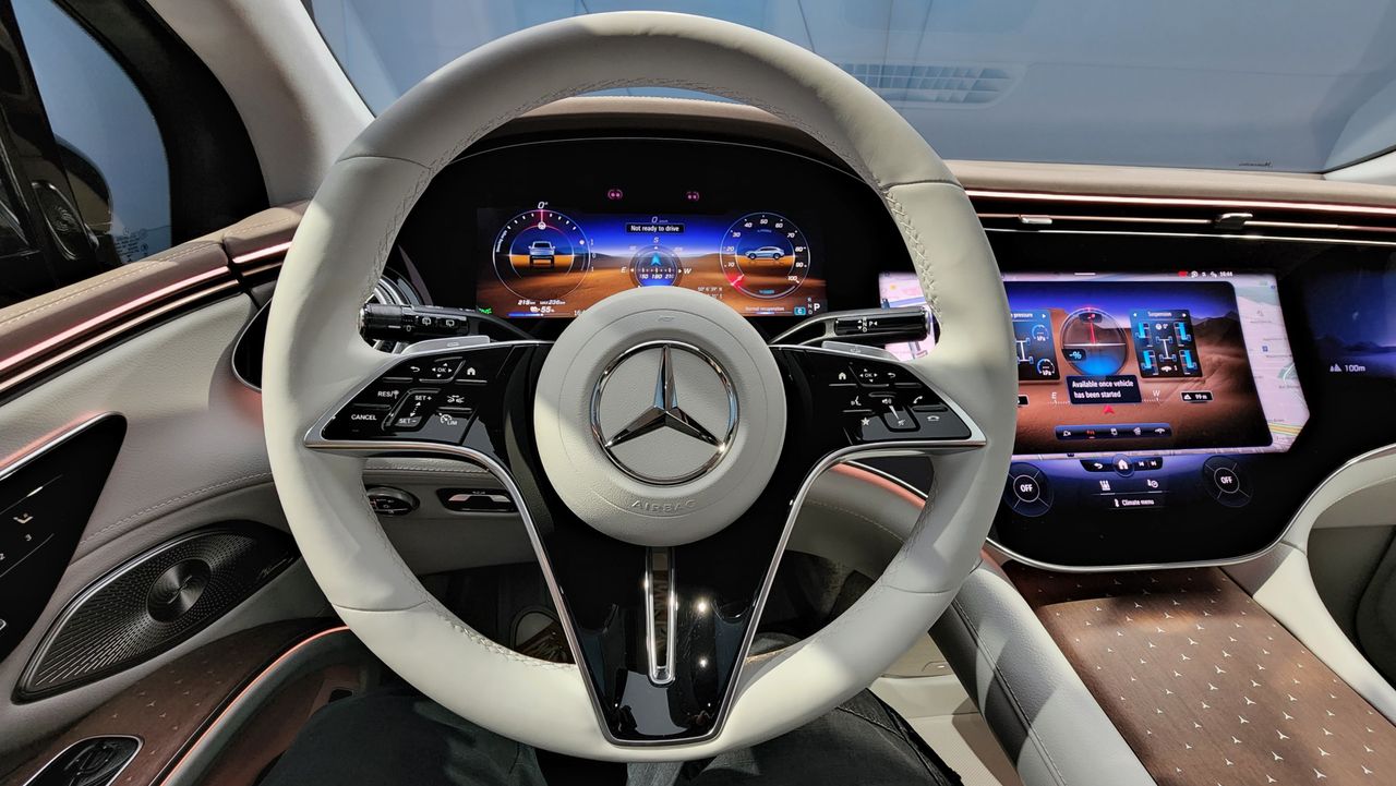 Driver's seat view of steering wheel and screens