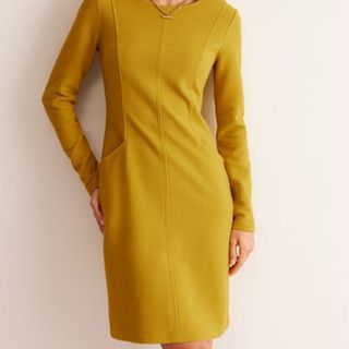 Woman in a yellow Boden dress 