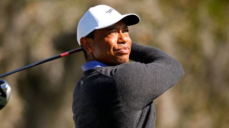 Tiger Woods takes a shot in a practice round before the PNC Championship