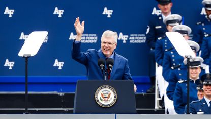 Troy Meink waving to the crowd during Space Force graduation ceremony