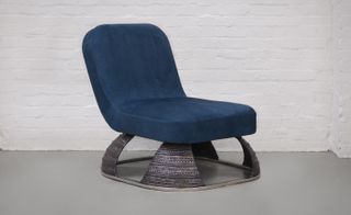 The ‘Armour Chair’ features striking turquoise green suede upholstery