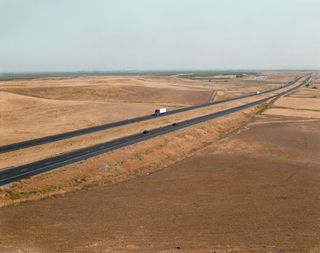A long stretch of road through the San Joaquin Valley, California