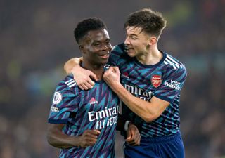Arsenal’s Bukayo Saka (left) celebrates with team-mate Kieran Tierney after scoring their side’s third goal of the game during the Premier League match at Elland Road, Leeds. Picture date: Saturday December 18, 2021
