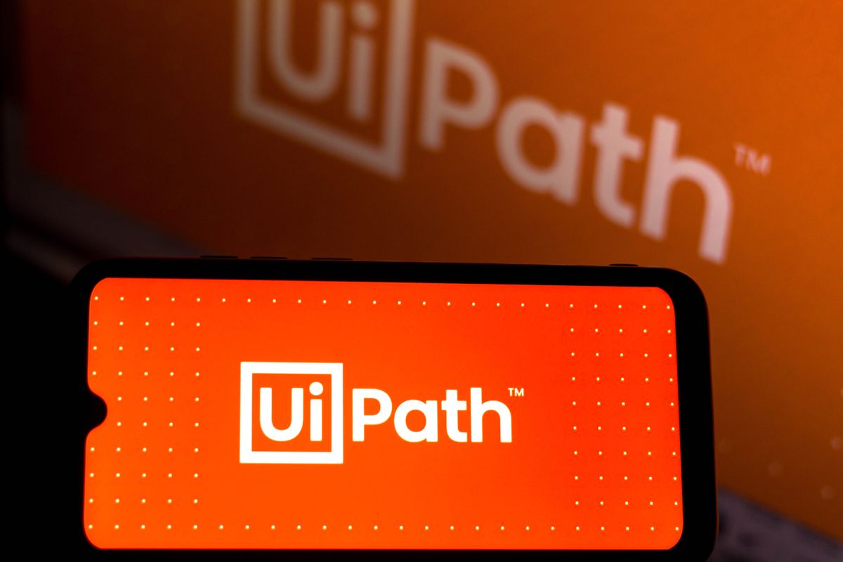 UiPath logo displayed in white lettering on a red background on smartphone screen.