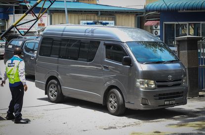 A grey van believed to be carrying Kim Jong Nams body.