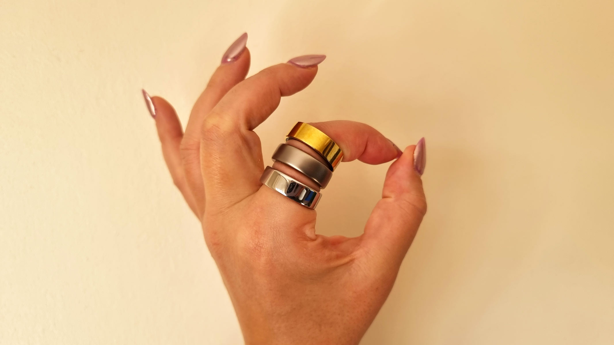 A close-up picture of our tester wearing three smart rings at once
