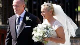 Mike Tindall and Zara Phillips leave Canongate Kirk after their wedding on July 30, 2011 in Edinburgh, Scotland. The Queen's granddaughter Zara Phillips will marry England rugby player Mike Tindall today at Canongate Kirk. Many royals are expected to attend including the Duke and Duchess of Cambridge.