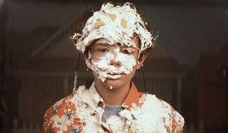 Honey Boy young James Lort covered in pie filling