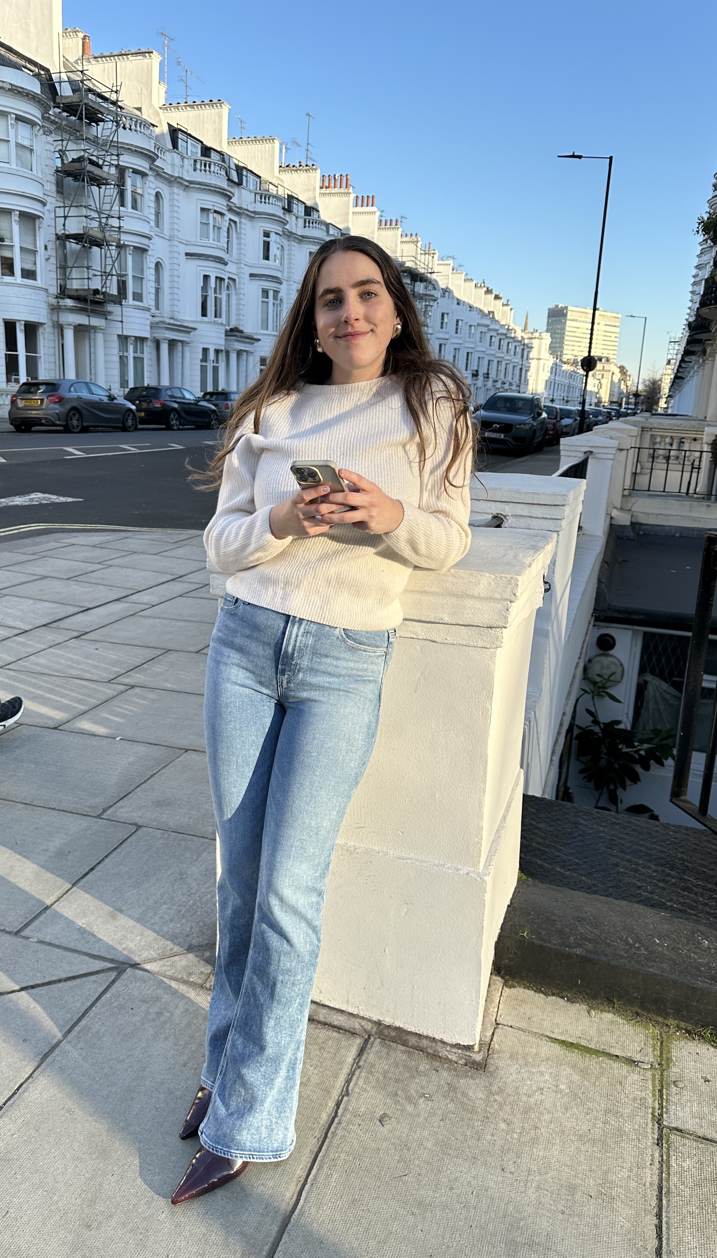 An image of Who What Wear SEO Writer Ava Gilchrist wearing one of the best flared jeans.