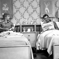 Lucille Ball and Desi Arnaz sleeping in separate beds on the I Love Lucy show