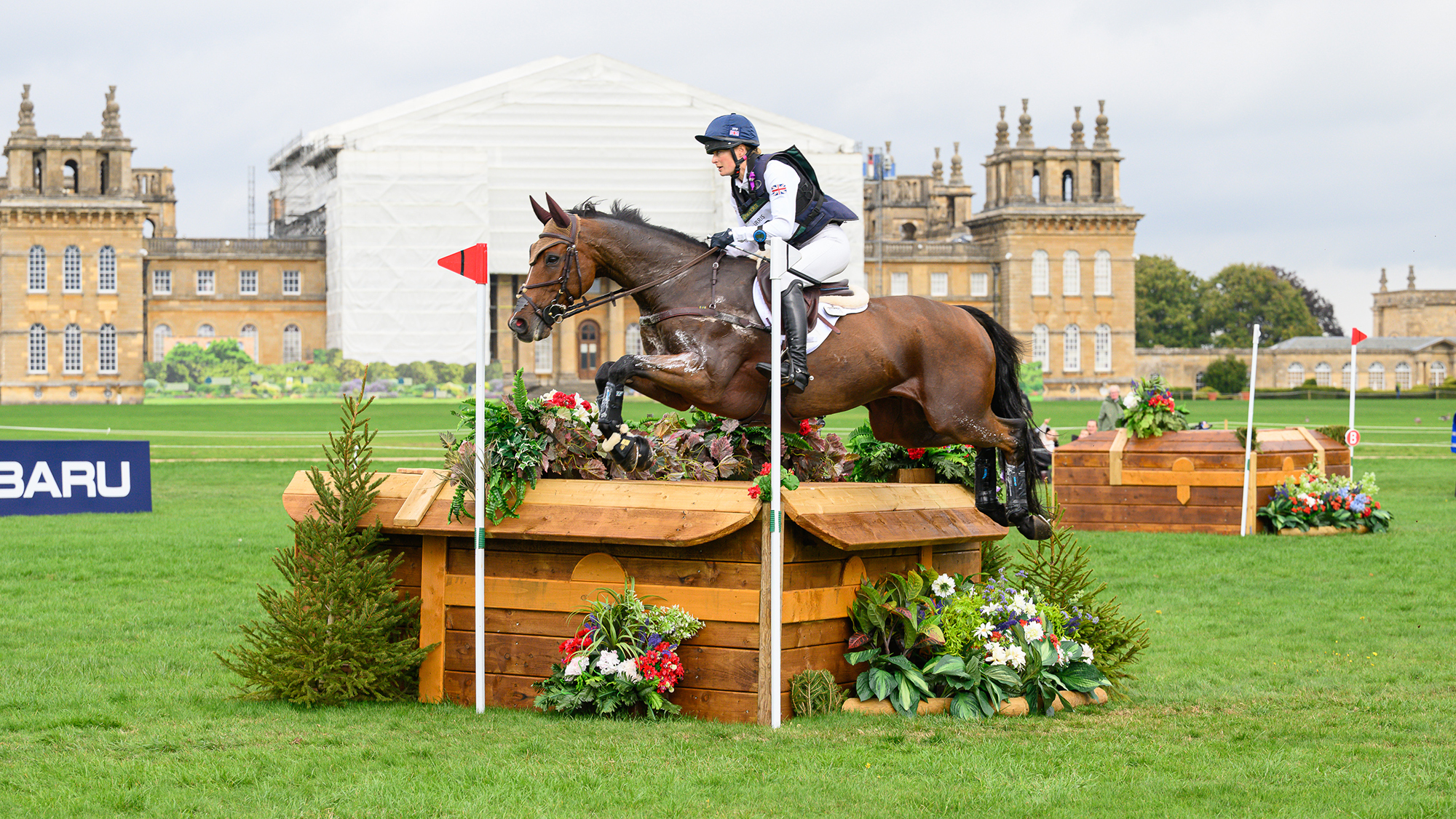 Caroline Harris and D. Day, British squad members for the 2026 World Championships, jump a cross-country fence at the European Championships at Blenheim in 2025