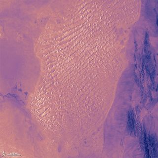 The Lut Desert in Iran as seen in infrared wavelengths, taken by the Landsat 7 satellite on July 6, 1999.