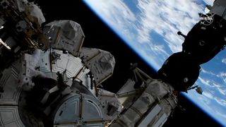 One of the space station's external cameras captured this beautiful view of Earth as NASA astronaut Christina Koch grabbed some supplies from the Quest airlock.