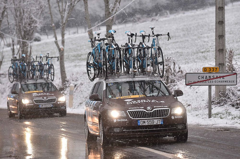 An AG2R vehicle on course on the snow